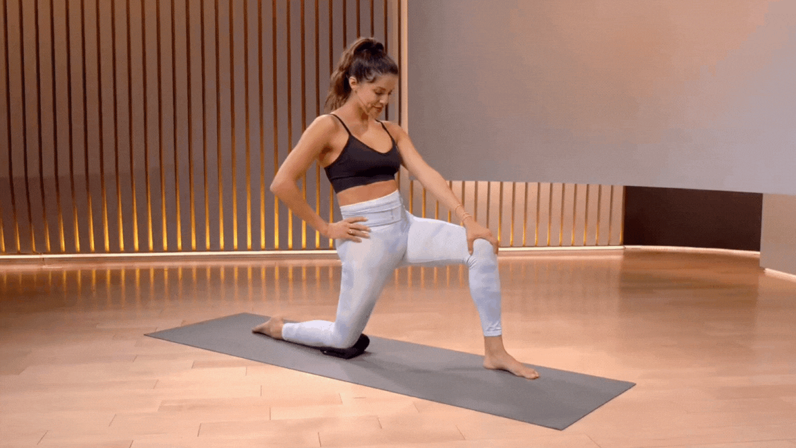 Peloton instructor Hannah Corbin doing a kneeling hip flexor stretch.