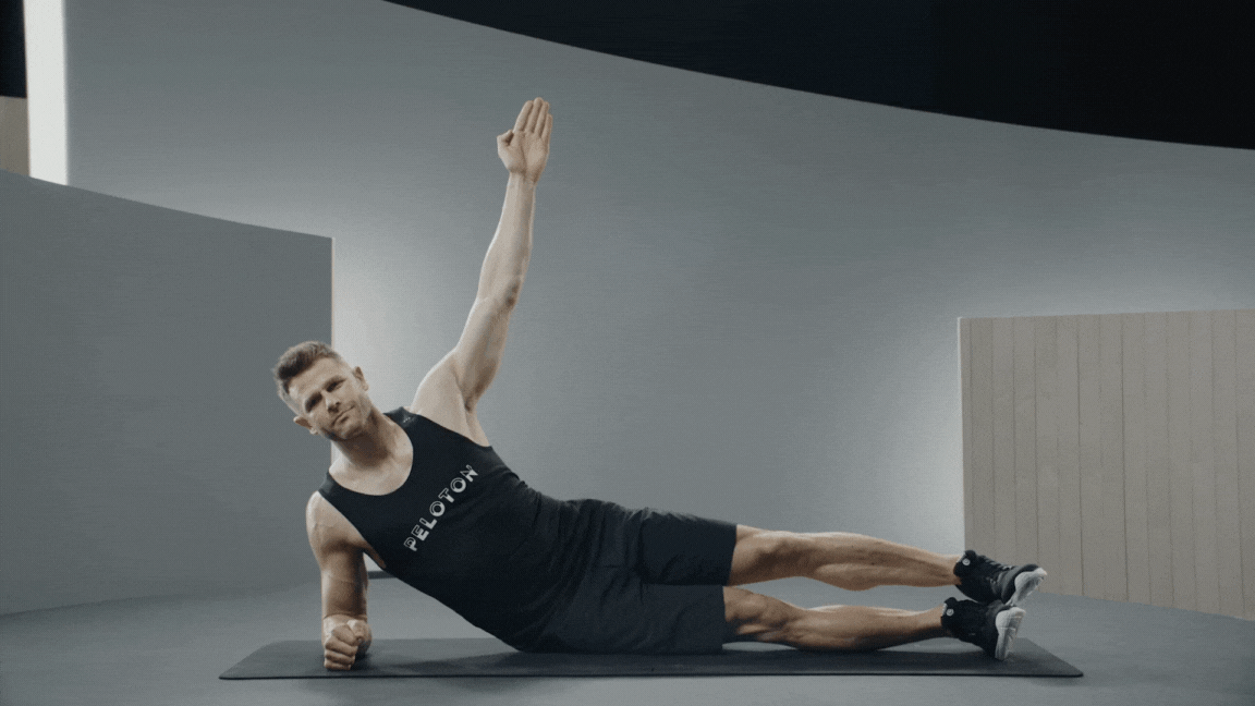 Peloton instructor Andy Speer demonstrates the side plank oblique exercise