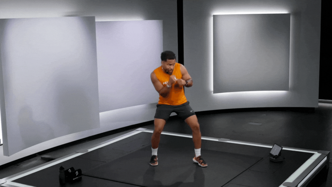 Peloton instructor Rad Lopez shadowboxes during a workout warm-up.