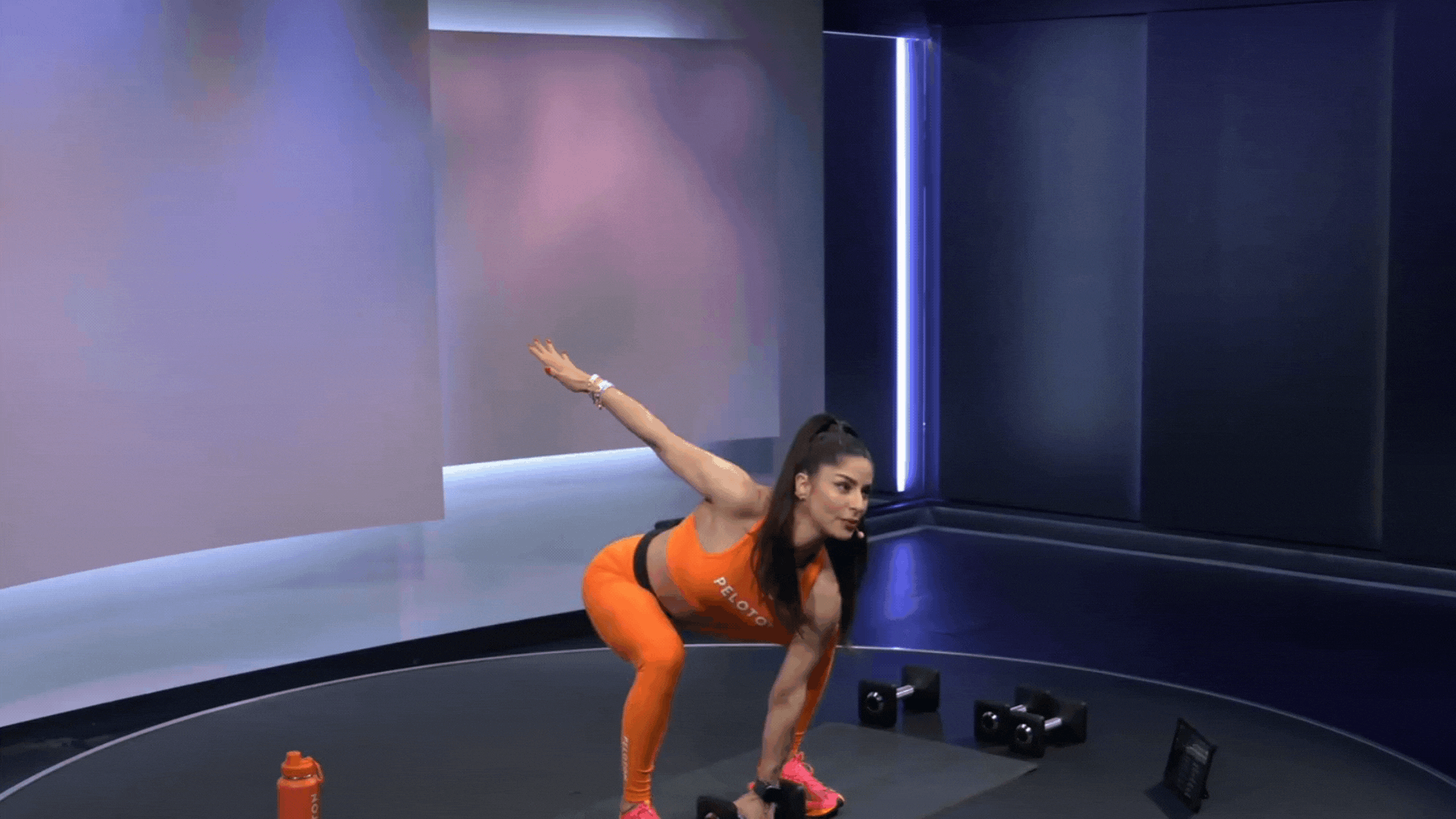 Assal Arian doing a dumbbell snatch