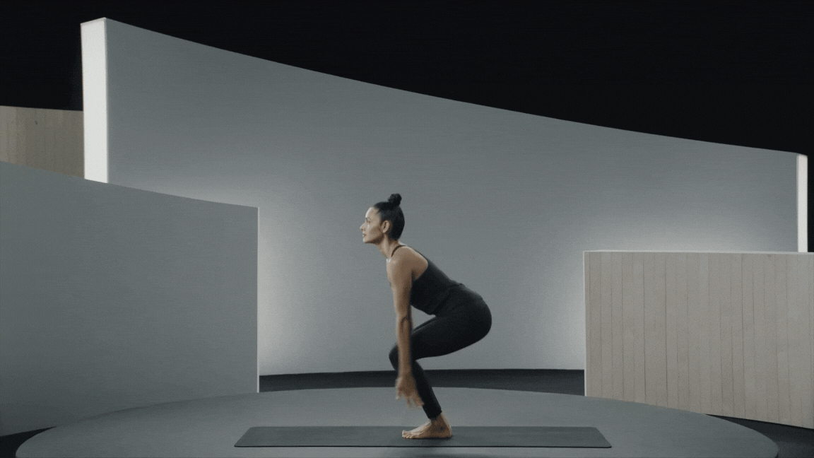 Peloton instructor Aditi Shah demonstrating Chair Pose.