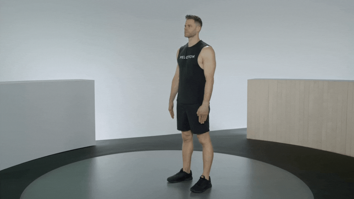 Peloton instructor Andy Speer demonstrates a bent-over Y raise rear deltoid exercise.