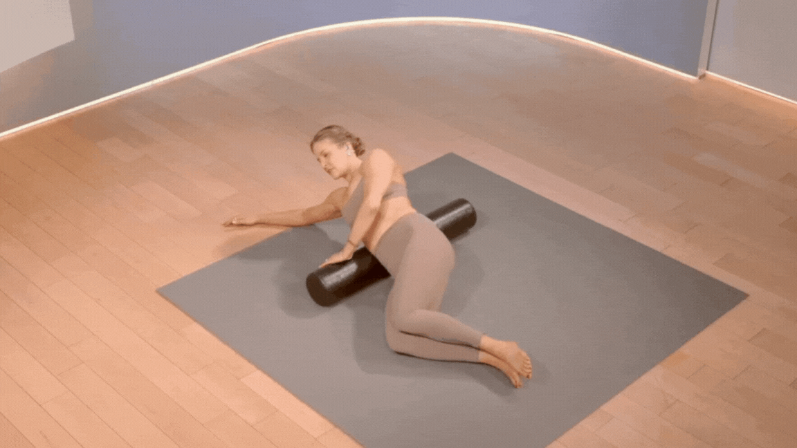 Peloton instructor Rebecca Kennedy demonstrates QL foam rolling in a foam rolling Peloton class.