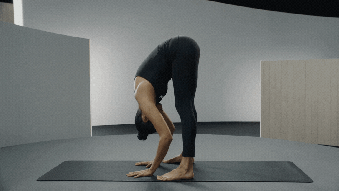 Peloton instructor Aditi Shah demonstrating yoga's Garland Pose (Malasana) with proper form.