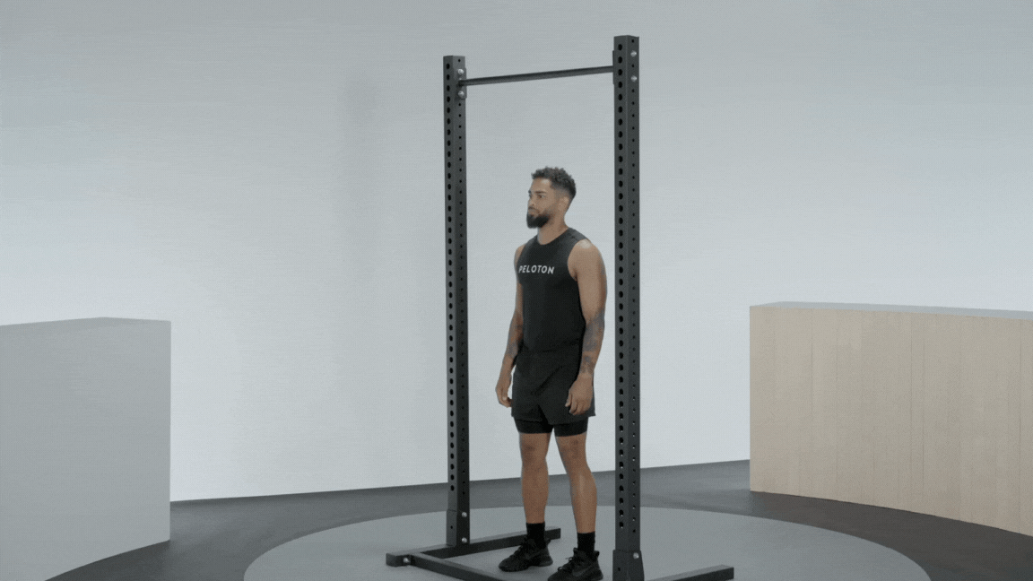 Peloton instructor Rad Lopez demonstrates a pull-up bodyweight back exercise.