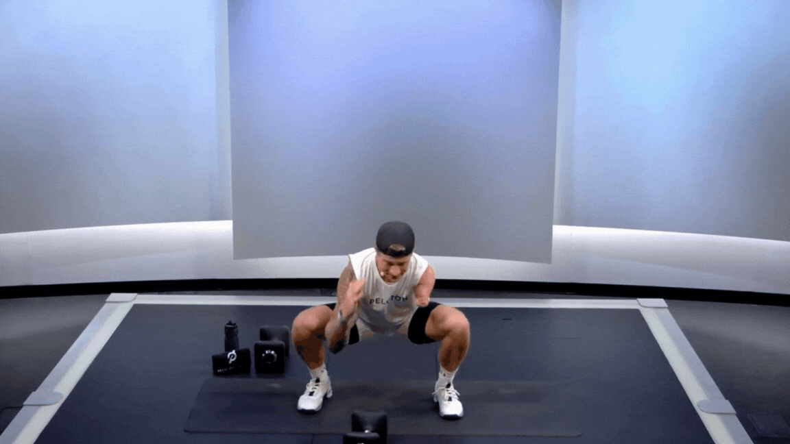 Logan Aldridge doing unweighted squat in Peloton class (GIF)