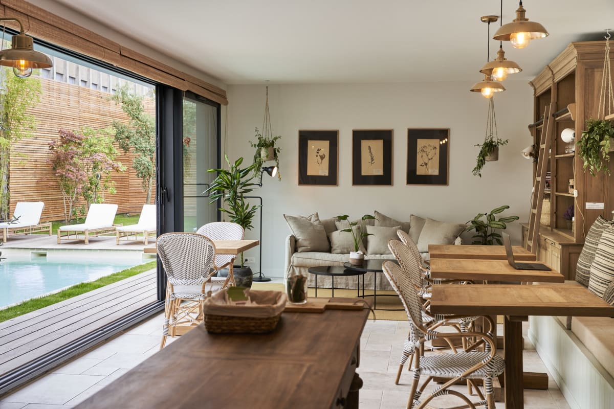 The shared lounge opening onto the pool and garden
