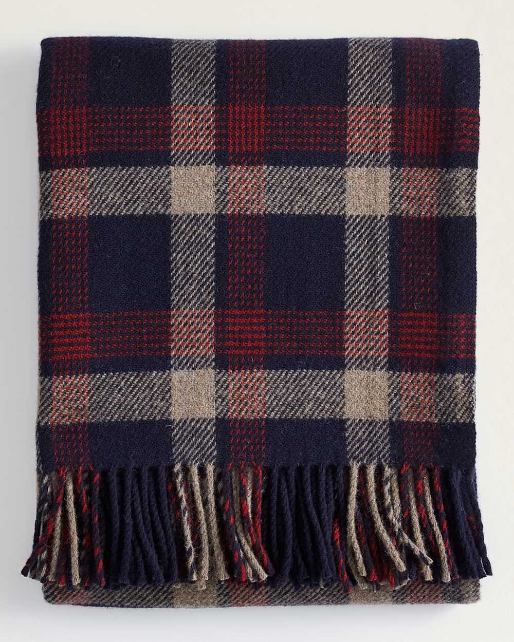 FOLDED VIEW OF ECO-WISE WOOL FRINGED THROW IN NAVY KELSO PLAID image number 1