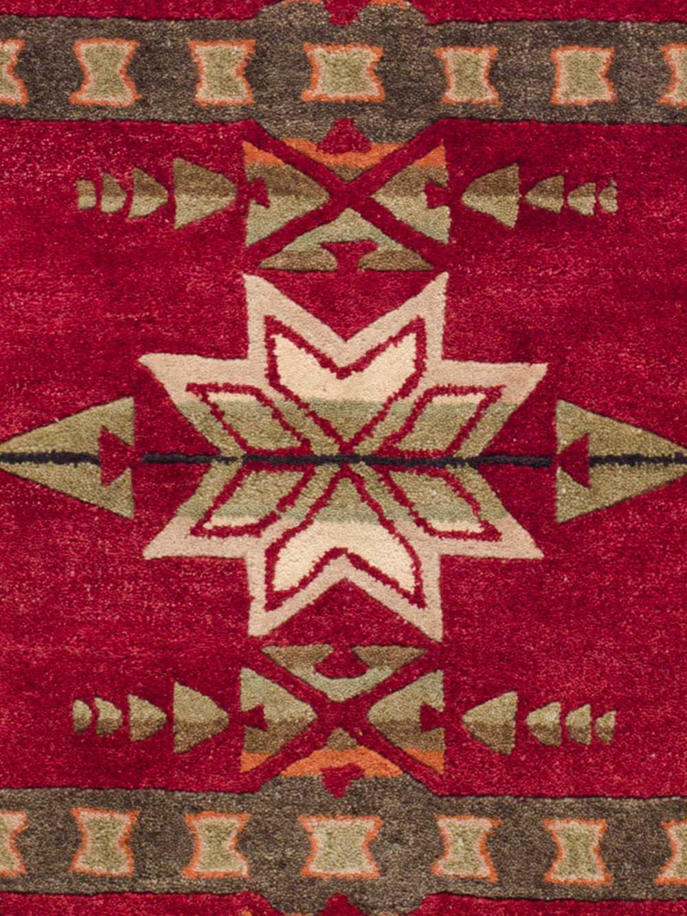 CLOSE UP OF HANDMADE GATEKEEPER RUG IN RED image number 2
