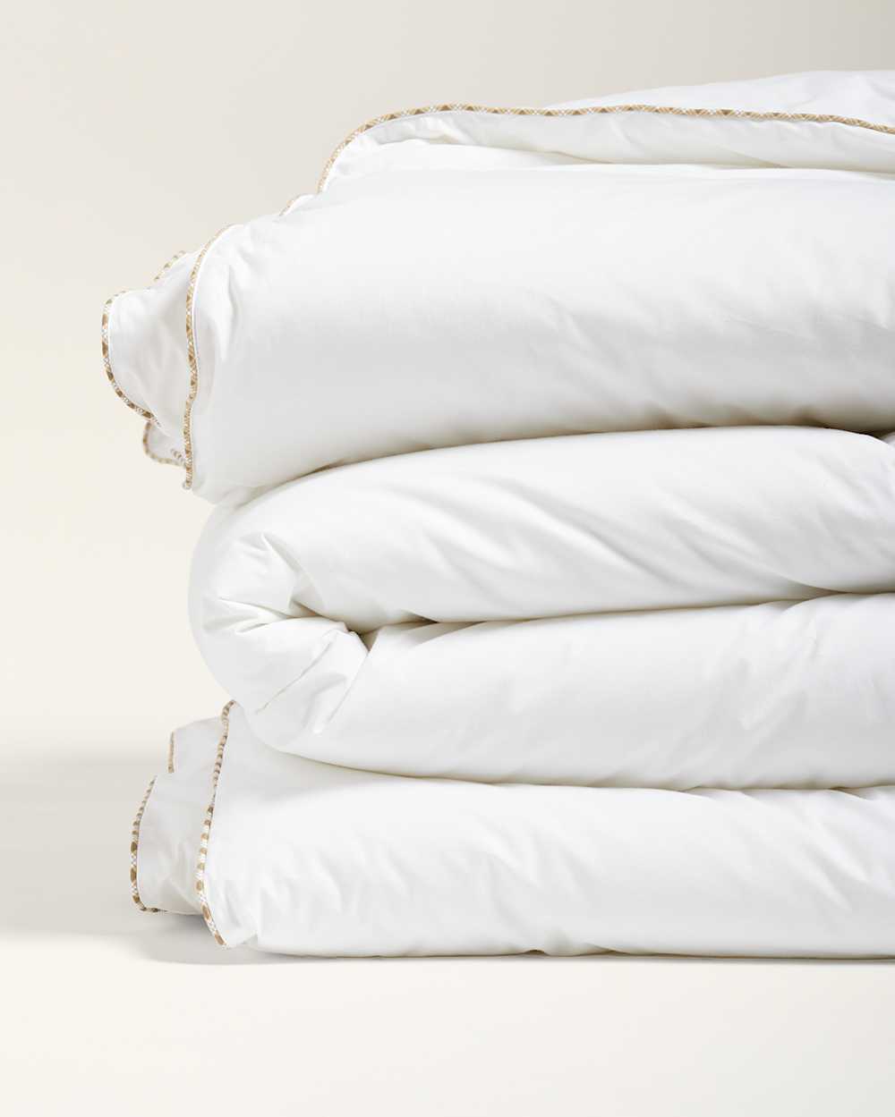 CLOSE UP FOLDED VIEW OF DOWN ALTERNATIVE COMFORTER IN WHITE image number 4