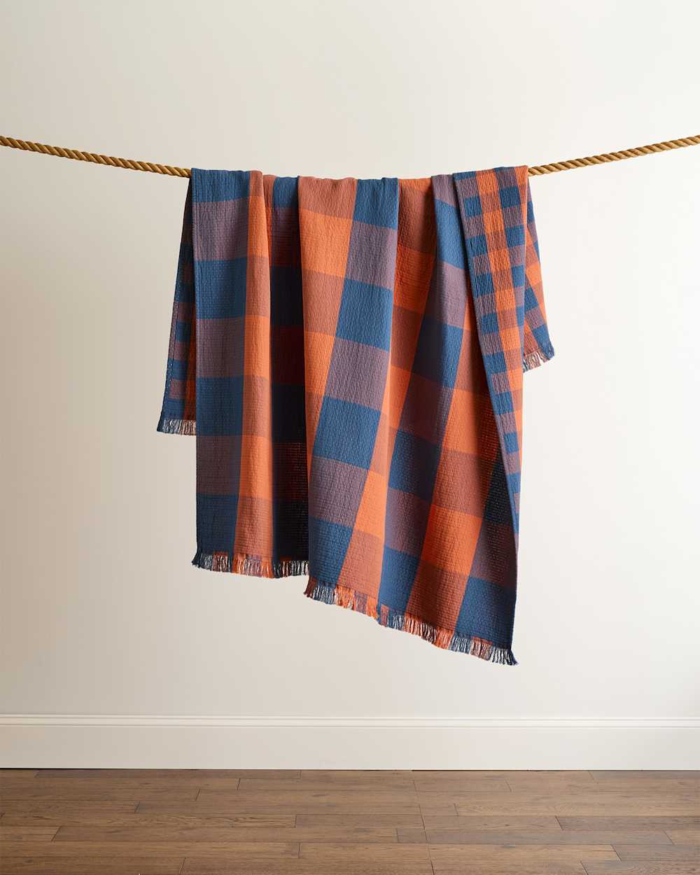 BLOCK PLAID ORGANIC COTTON FRINGED THROW IN COPPER/INDIGO image number 1