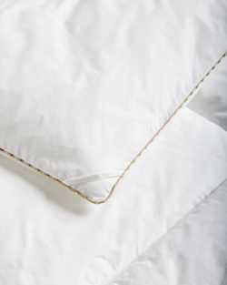 CLOSE UP VIEW OF DOWN ALTERNATIVE COMFORTER IN WHITE image number 3