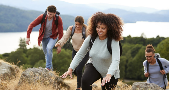 A group of young adults hiking in nature