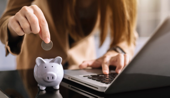 Placing coin in piggybank