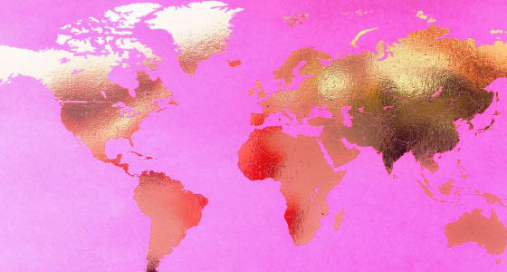 World map with gold countries on a pink background