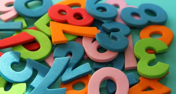 pile of felt numbers in numerous colours including green, blue and red