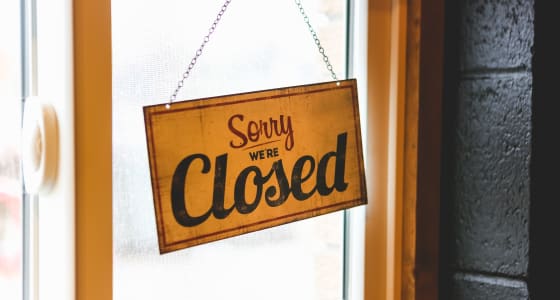 Shop door with a sign that reads 