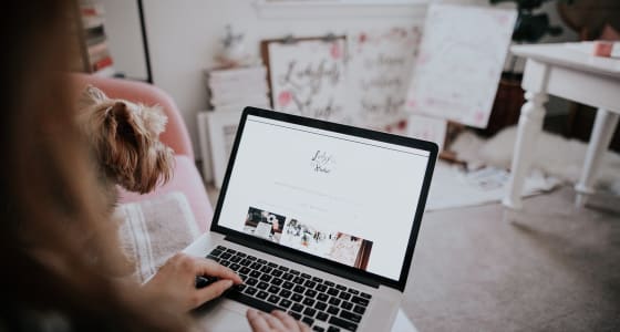 Women sat down working on a laptop