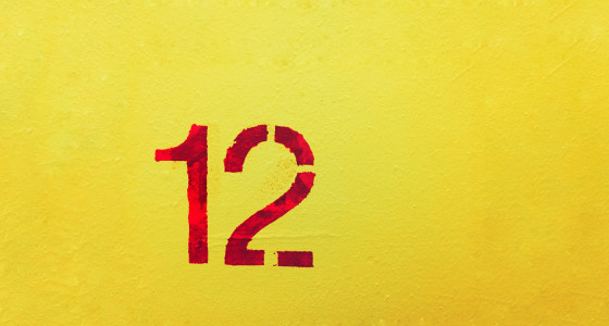 number 12 in red lettering on a yellow background