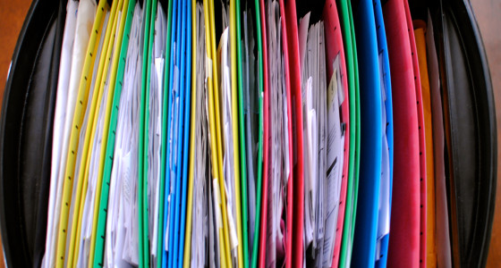 Black drawer filled with brightly coloured folders