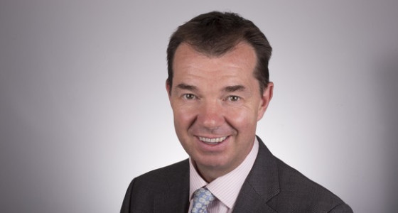 Pensions Minister, Guy Opperman, in front of white background