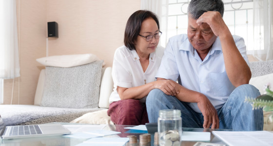 A couple looking concerned about money