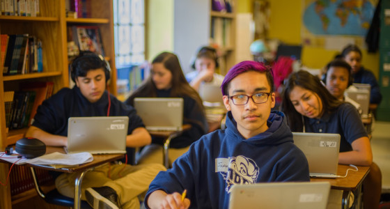 Students in a classroom with laptops