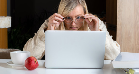 Shocked lady staring at a laptop screen