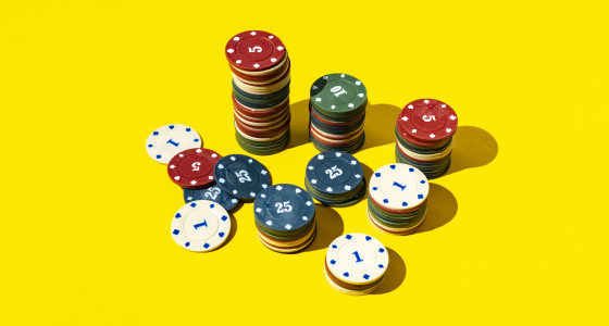 Poker chips on a yellow background