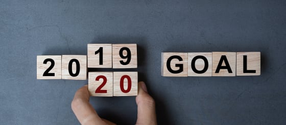 Small wooden cubes with the words 2019, 2020 goals printed on