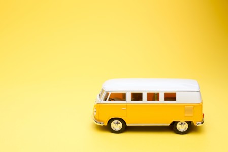 a yellow campervan on a yellow background.