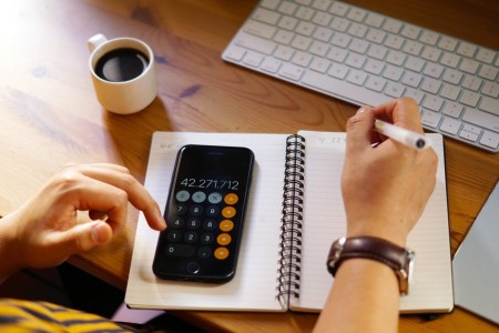 Man using calculator