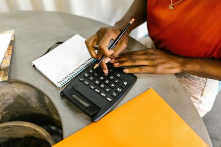 A woman's hands with a calculator.