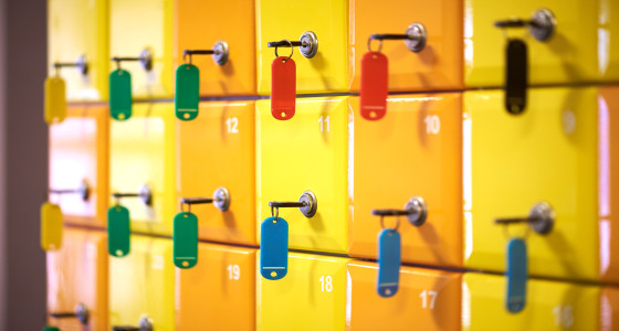 Numbered secure lockers with keys.