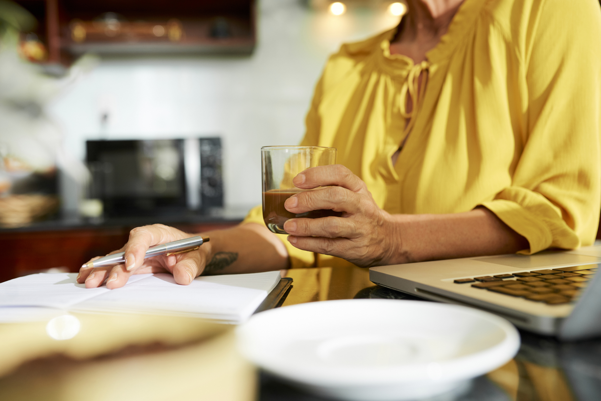 A woman writing in her planner.