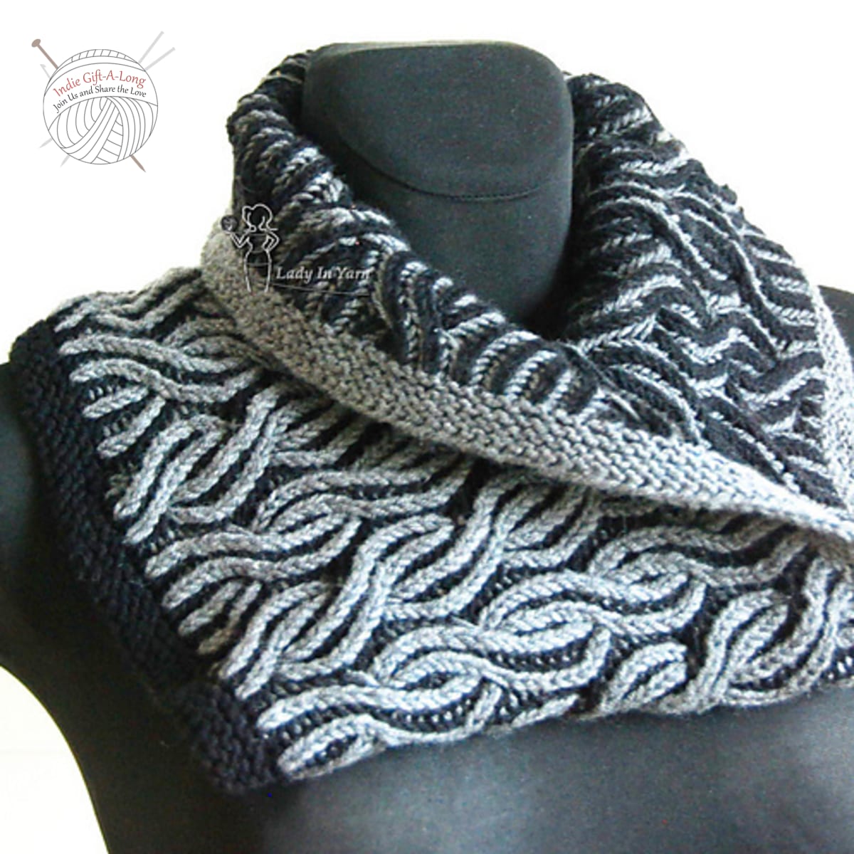 Knitted cowl in white and black brioche stitch.