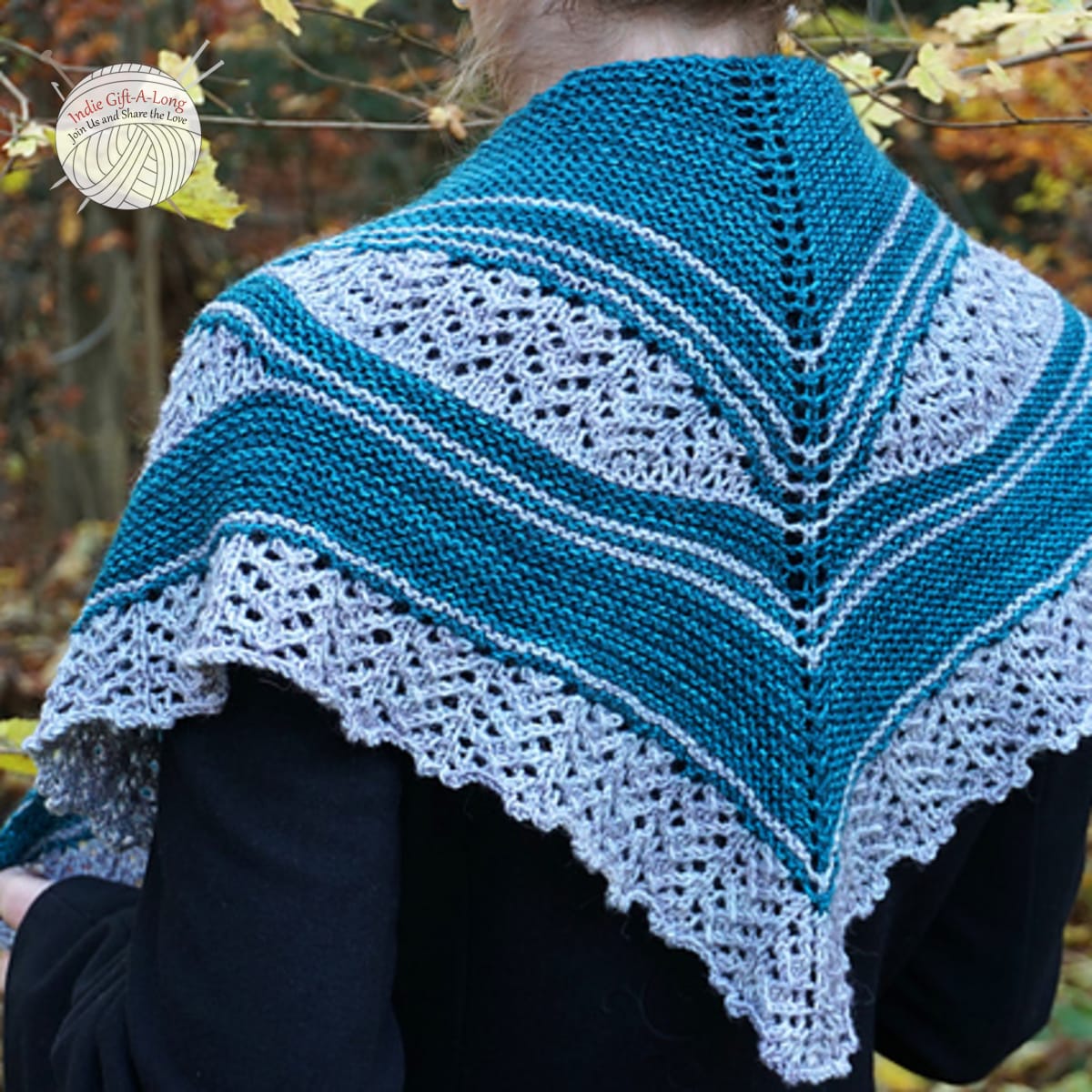 Woman wearing blue knitted shawl with wavy sections of white lace.