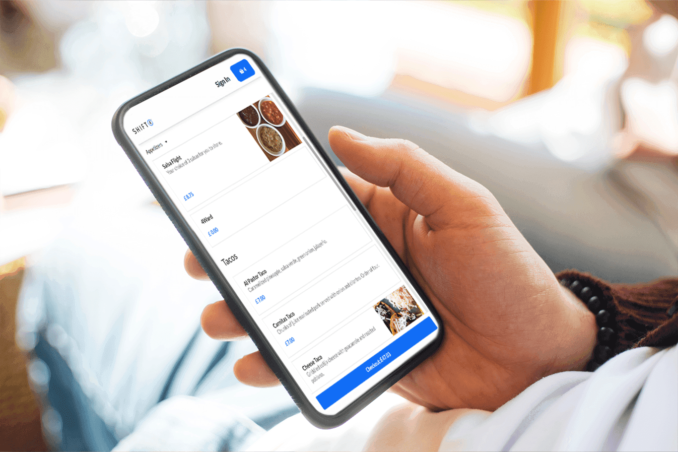Person ordering food on their smartphone using SkyTab POS online ordering