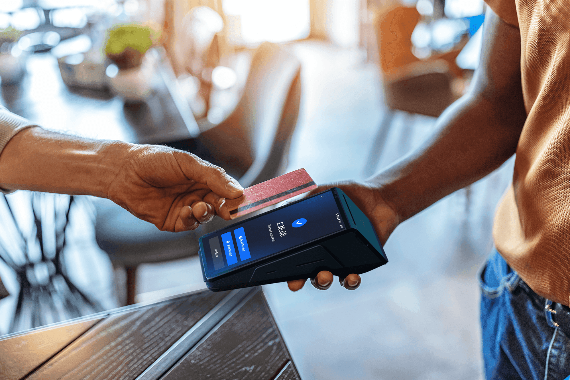 Customer using tap to pay with a SkyTab Mobile POS device