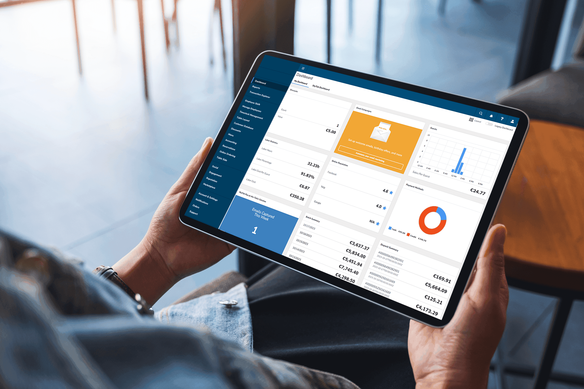 Holding a tablet with Lighthouse Business Manager