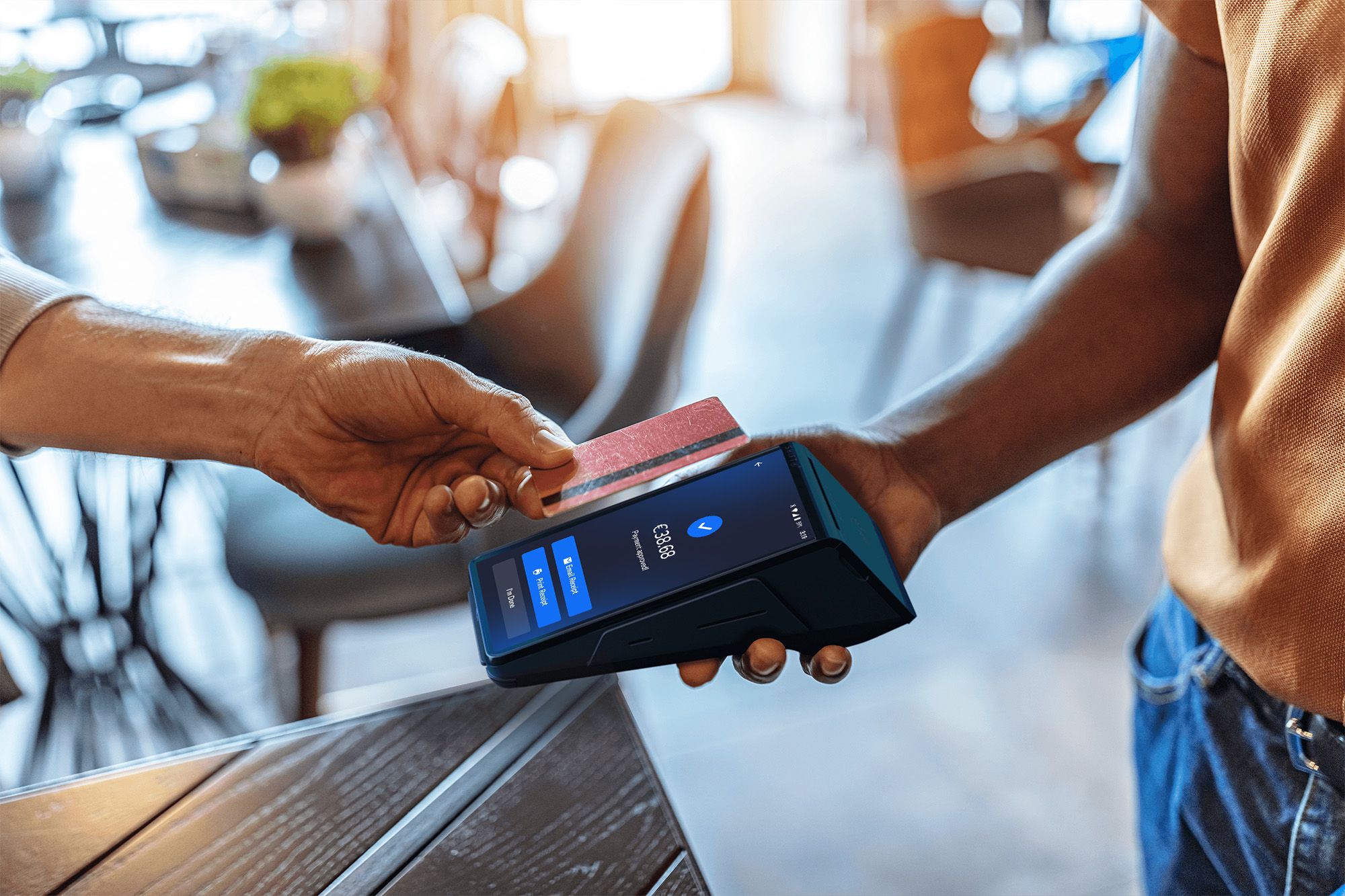 Customer using tap to pay with a SkyTab Mobile POS device