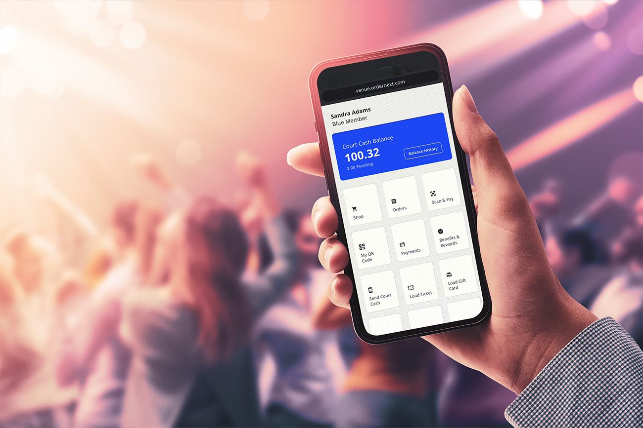 A sports fan using their smartphone to access the SkyTab Venue mobile wallet