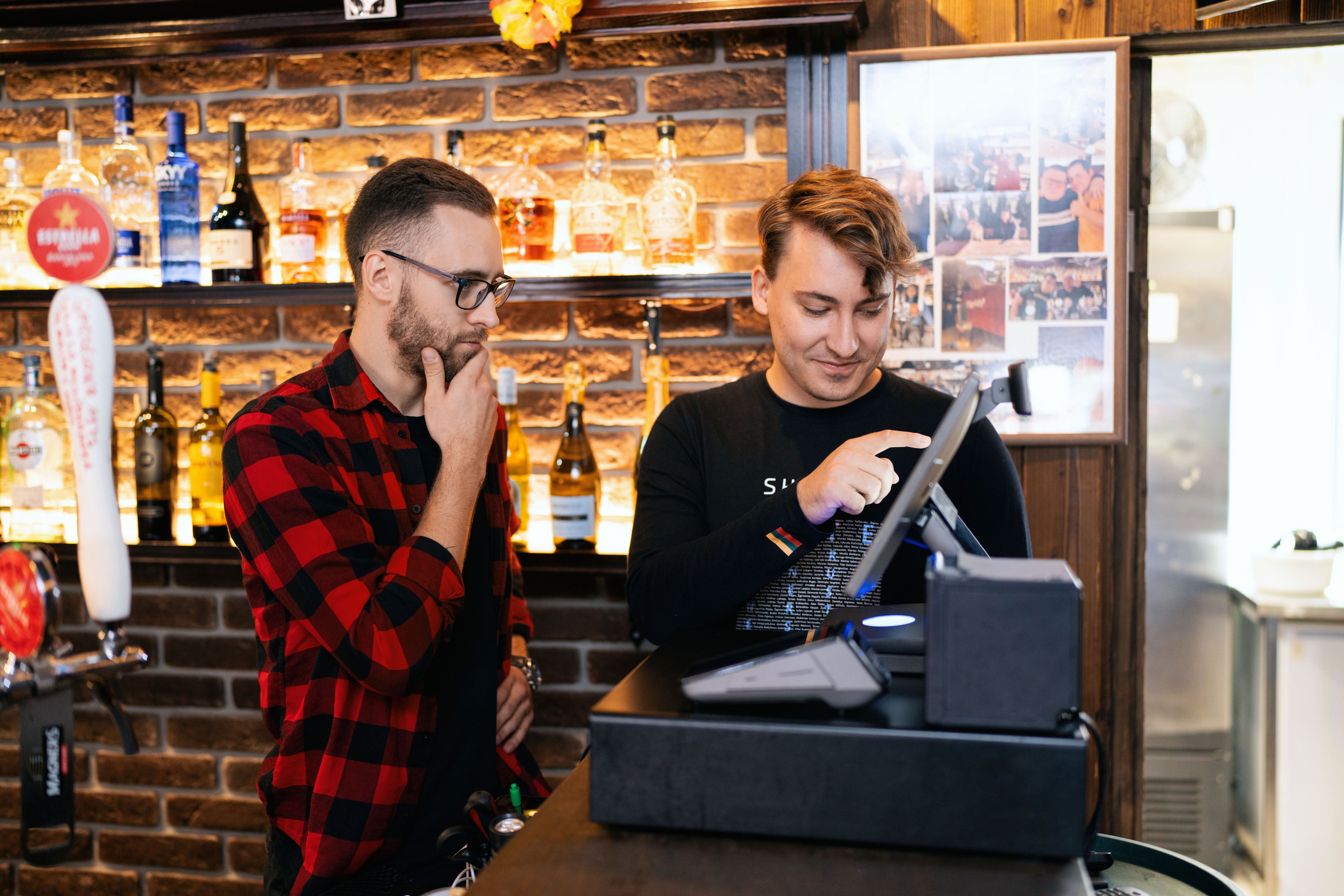 SkyTab POS installer training a restaurant owner