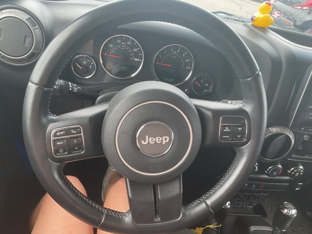 2015 Jeep Wrangler Unlimited used convertible for sale at Peterson Auto Sales in Midvale, UT — photo 18 of 21