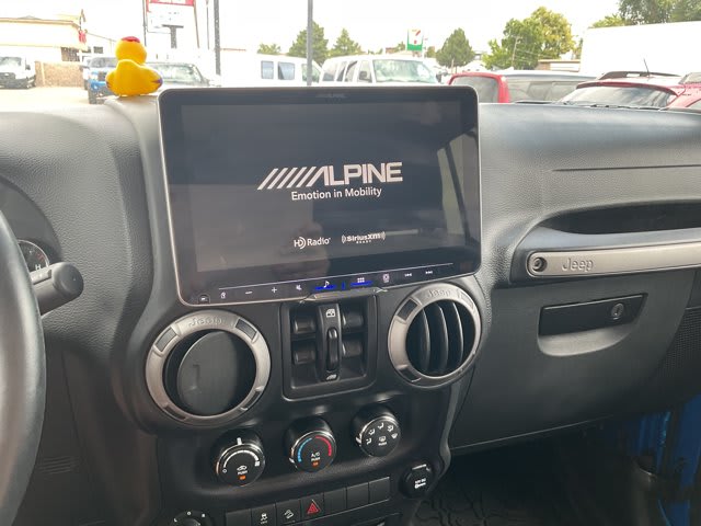 2015 Jeep Wrangler Unlimited used convertible for sale at Peterson Auto Sales in Midvale, UT — photo 16 of 21