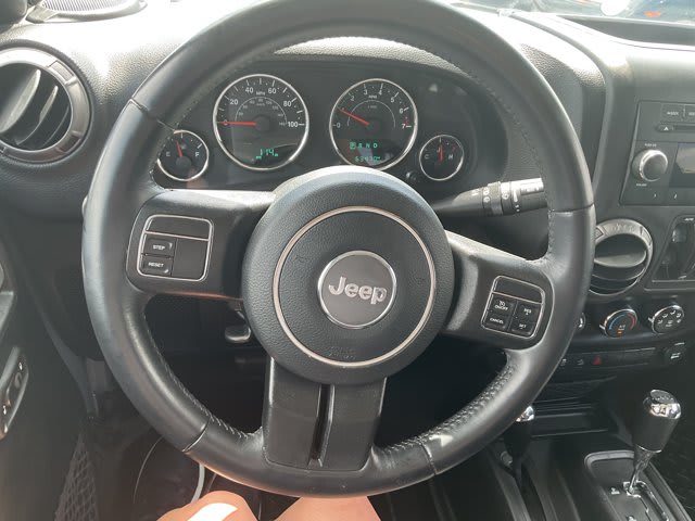 2018 Jeep Wrangler JK Unlimited used convertible for sale at Peterson Auto Sales in Midvale, UT — photo 16 of 23