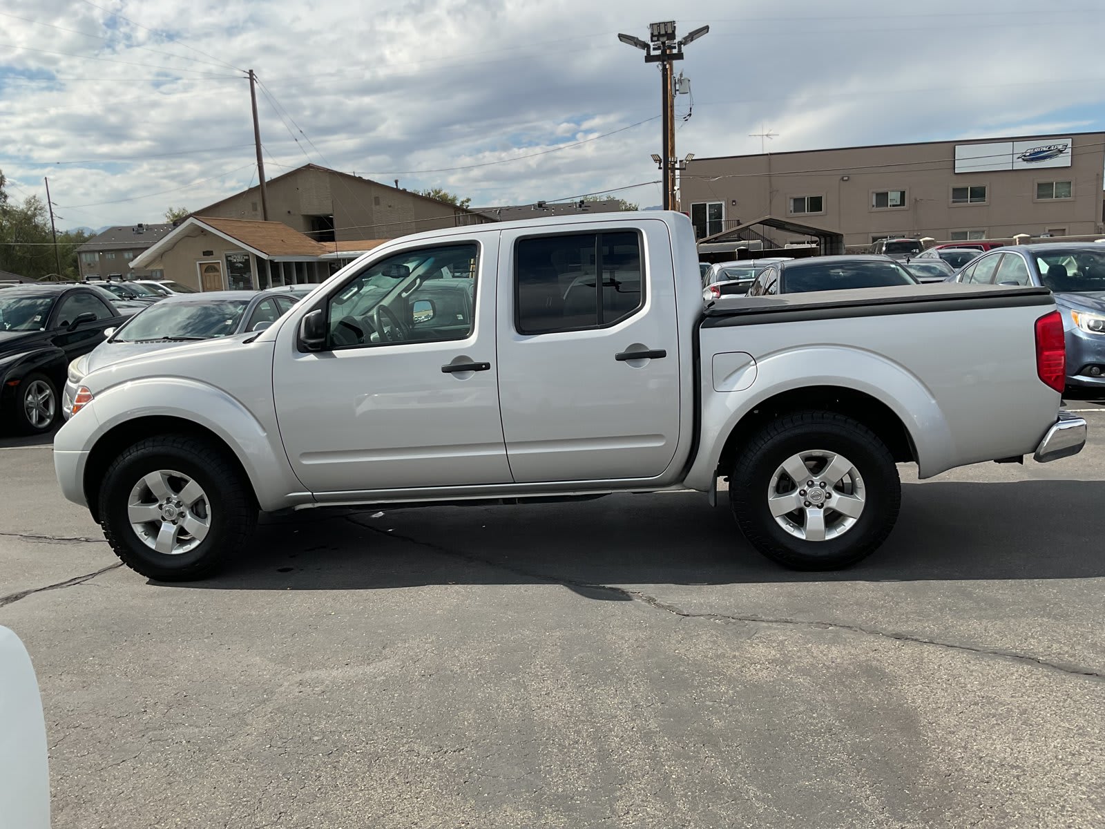 2013 Nissan Frontier used crew cab pickup for sale at Peterson Auto Sales in Midvale, UT — photo 5 of 20