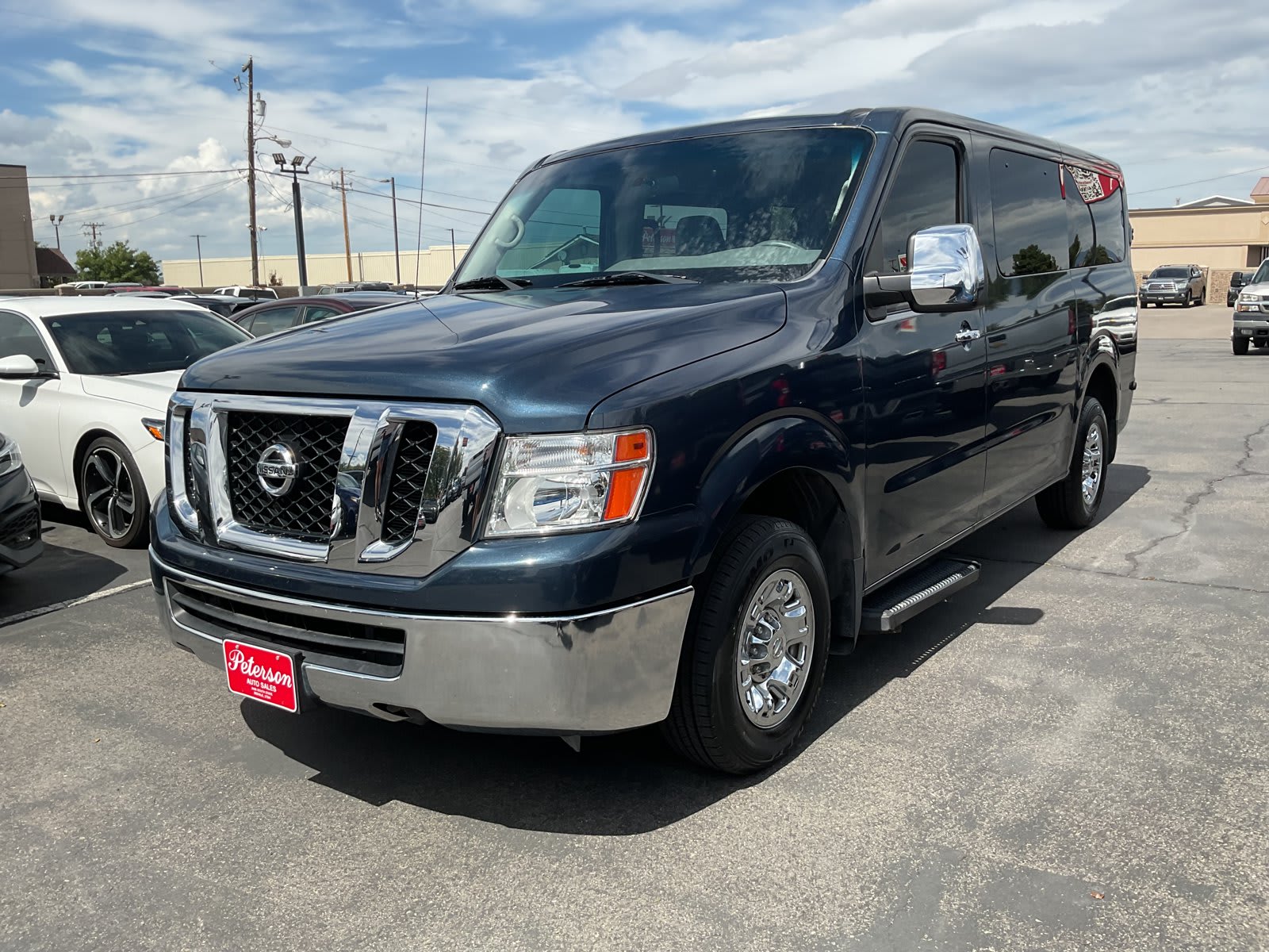 2019 Nissan NV Passenger used full-size passenger van for sale at Peterson Auto Sales in Midvale, UT — photo 2 of 21