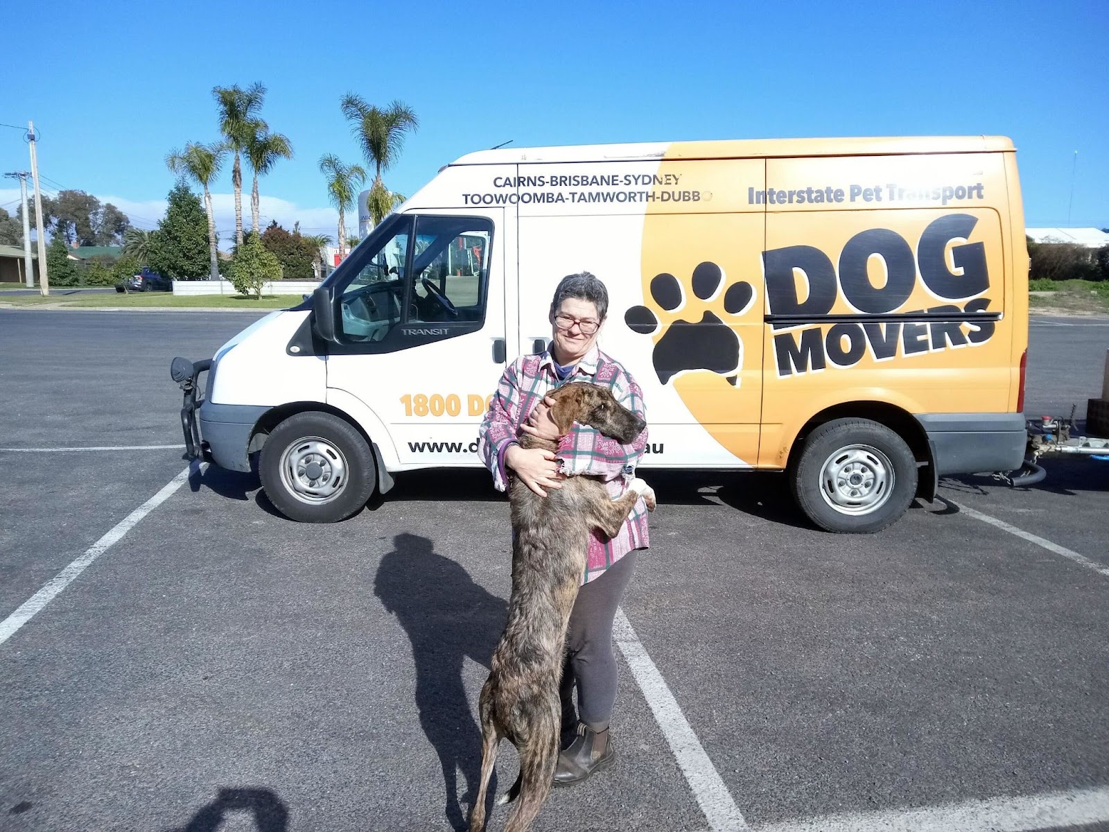 Sasha and Felicity having a cuddle outside the DogMovers van when they met