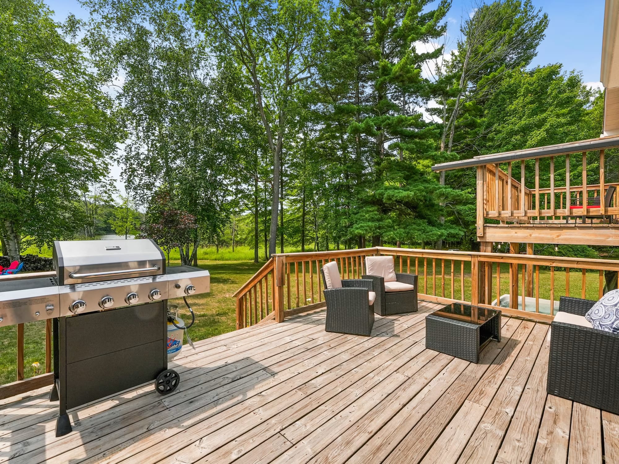 Lakefront Paradise Vacation Home Rental deck with seating and grill